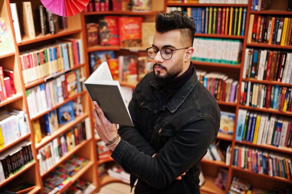 Arab student man at library