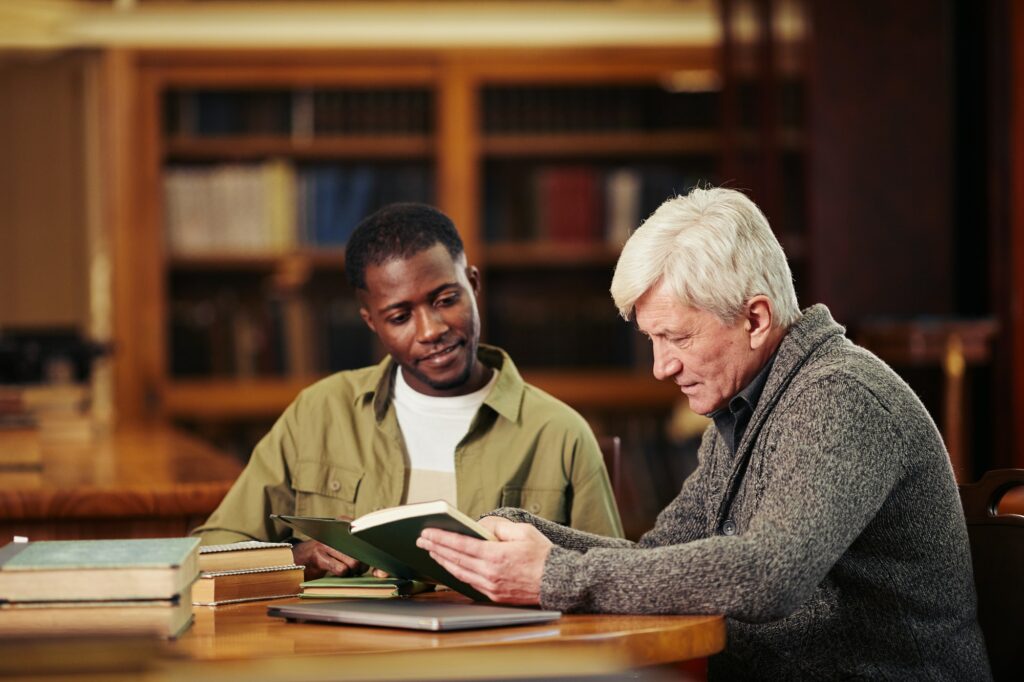 Two Men Reading in Library