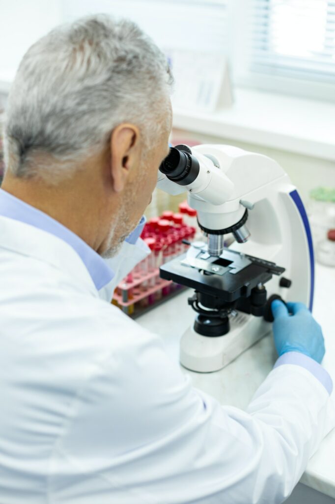 Concentrated medical worker doing analysis in lab