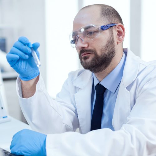 Genetic scientist conducting pharmacology exepriment