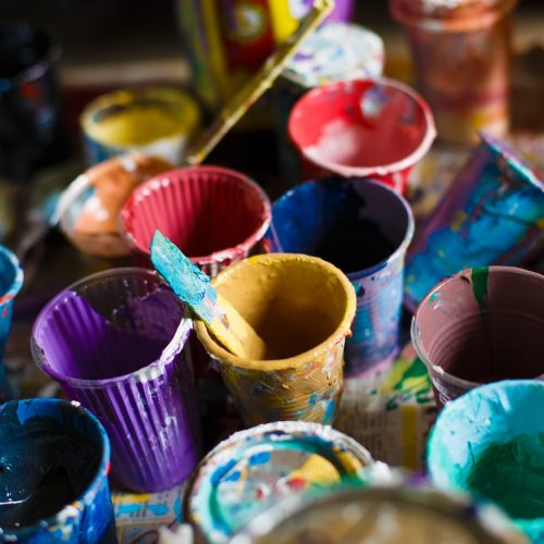 multicolored cans with paint, arts background